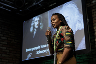 Melissa Sikosana (GT 2014) showcasing her research through an entertaining science slam presentation